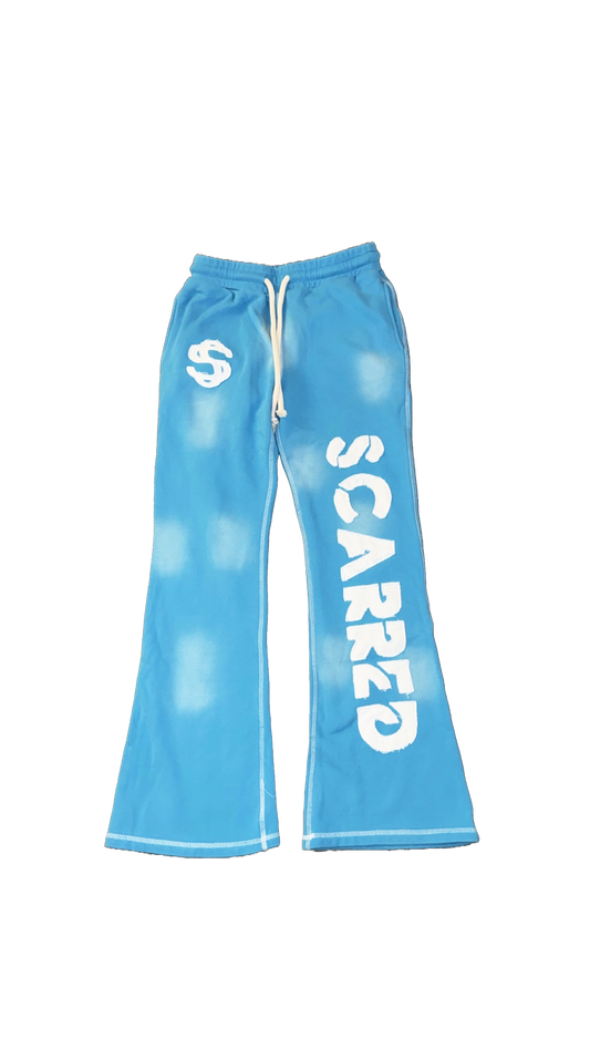 “Scarred” blue sweats